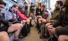 Travellers cast off inhibitions on no pants subway ride day - in pictures