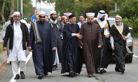 Delegates and religious leaders walk towards the Al Noor mosque in Christchurch. 