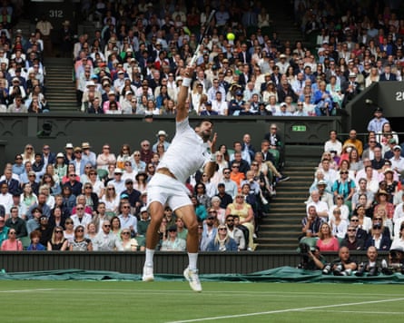 Novak Djokovic attempts a smash