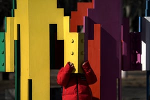 Beijing, China: a child plays in an art installation at the Olympic Park