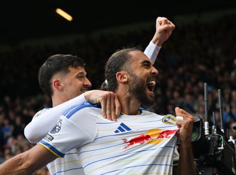 Dominic Calvert-Lewin shouts and raises a fist, celebrating a goal with a teammate
