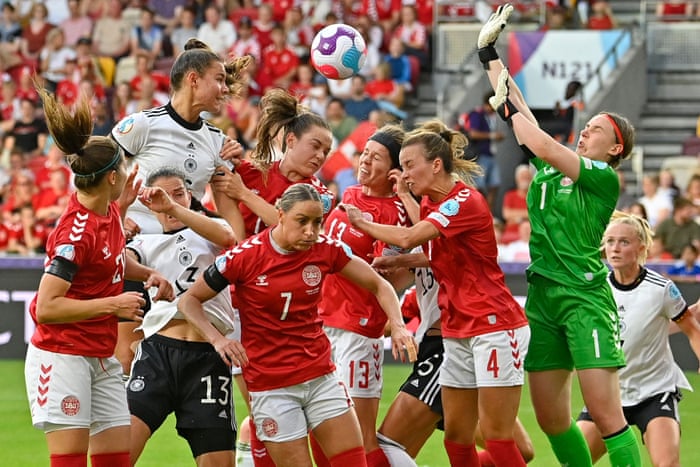 Germany’s midfielder Lena Oberdorf (second left) jumps to head the ball.