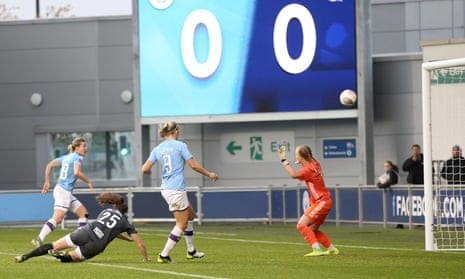 Ellen Whites (far left) guides home her first Manchester City goal.