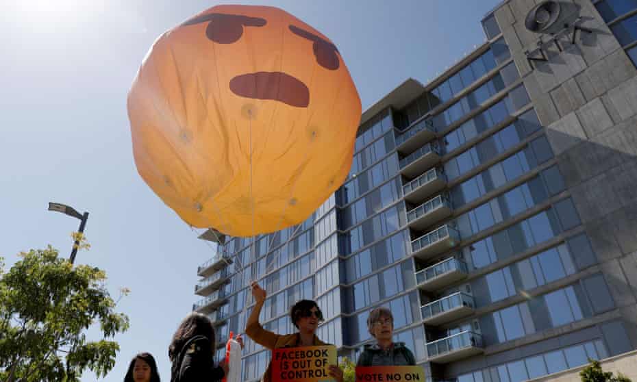 Protesters hold an inflatable angry emoji outside of Facebook’s annual shareholder meeting in Palo Alto, California.