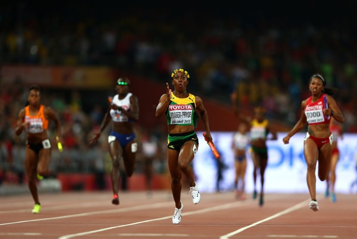 Shelly-Ann Fraser-Pryce crosses the finish line to win gold in the Women’s 4x100m Relay final