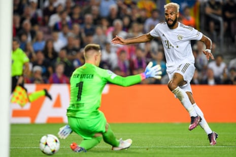 Bayern Munich's Eric Maxim Choupo-Moting (right) scores their second goal past Barcelona's goalkeeper Marc-Andre ter Stegen.