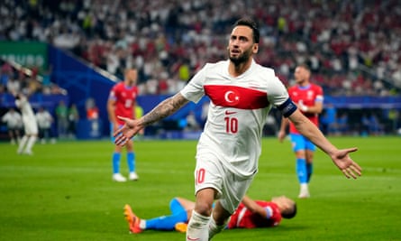 Hakan Calhanoglu celebrates scoring a goal