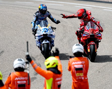 Marc Márquez congratulates brother Álex Márquez after they finished first and second.