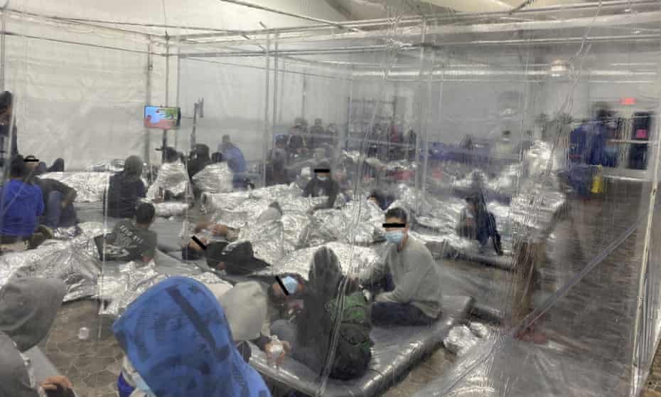 Migrants in a crowded room with walls of plastic sheeting in Donna, Texas, in a photo released 22 March. Henry Cuellar said more than 400 male minors were being held in a section meant for 250.