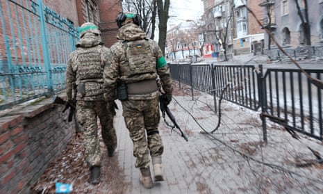Ukrainian soldiers patrol the heavily damaged city of Bakhmut, which has seen some of the most intense battles since Russia invaded.