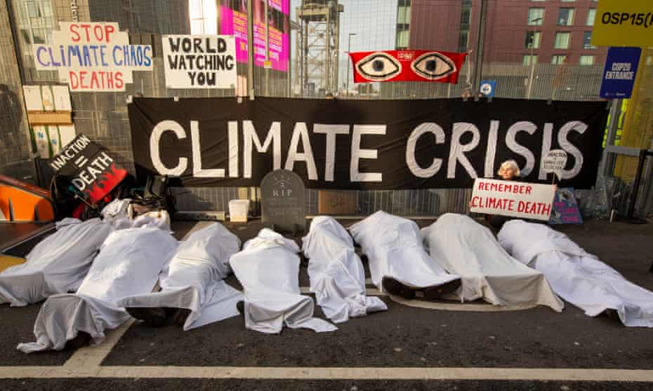 Extinction Rebellion members protest outside the main Cop26 entrance in Glasgow