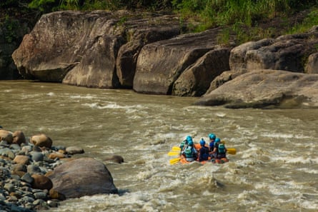 A white water rafting group on a large river