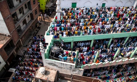 Muslims in the Mustafabad area of Delhi offer Friday prayers at a mosque following sectarian riots over India’s new citizenship law.