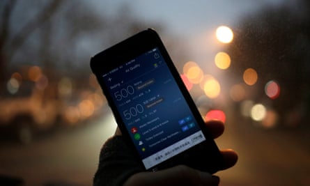 A view of an air quality monitoring app on a mobile phone showing PM2.5 concentration levels beyond the 500 index in Beijing, 1 December 2015.