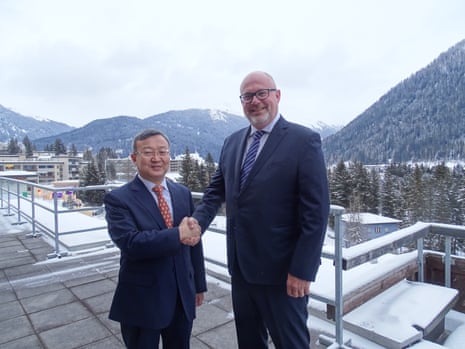 China’s vice-minister of commerce, Wang Shouwen, and Australia’s assistant trade minister, Tim Ayres, after their meeting on the sidelines of the World Economic Forum in Davos on Thursday night.