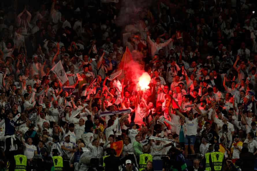 Real Madrid fans celebrate the first goal.