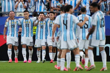 Lionel Messi, third left, celebrates with teammates after scoring his team's first goal