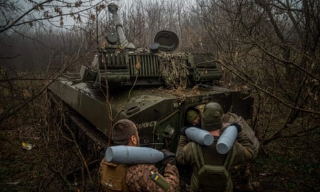 Amid heavy fighting around the eastern Ukrainian town of Bakhmut, Ukrainian soldiers load an ammunition inside of a 2S1 Gvozdika self-propelled howitzer.