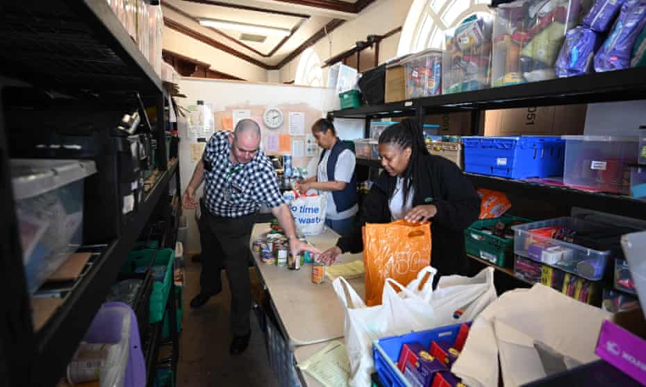 Volunteers pack food inside a Trussell Trust food bank in Oldham.