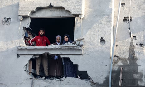 Palestinians inspecting the damage after Israeli strikes on the Zawayda area of the central Gaza Strip.