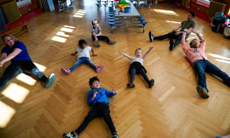 Children of key workers take part in a Joe Wicks exercise class at Oldfield Brow Primary School in Altrincham.
