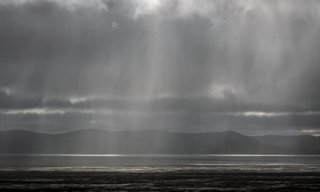 A cold front brings heavy rain over Lake George near Canberra