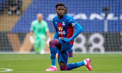Wilfried Zaha take a knee before Crystal Palace’s game against Everton in September.