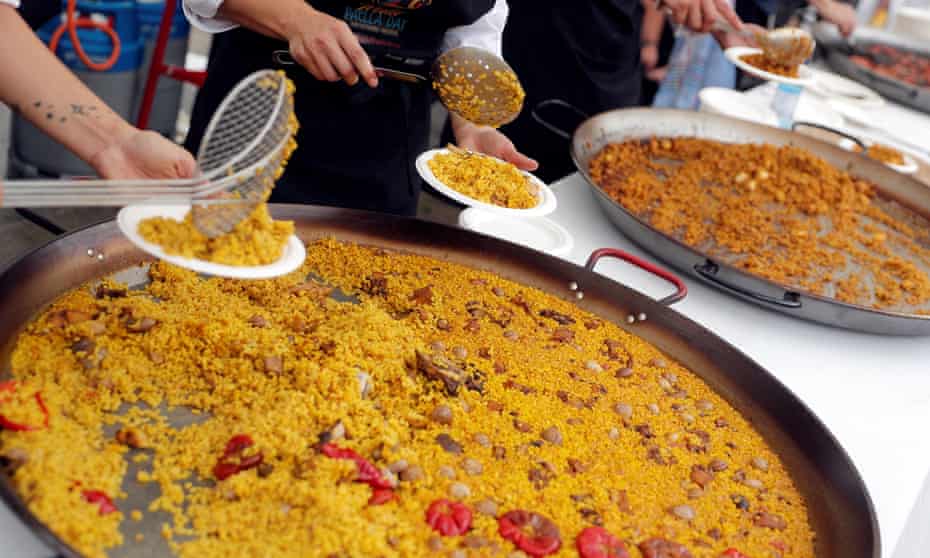 Chefs serve paella  in Valencia, Spain