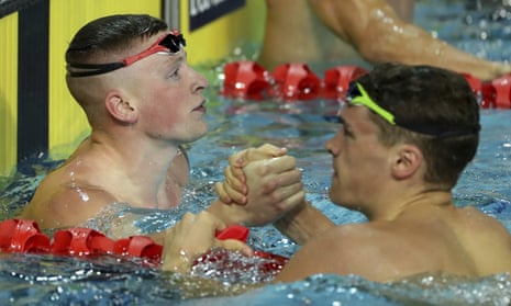 England’s Adam Peaty is congratulated by compatriot James Wilby after winning the men’s 100m breaststroke final.