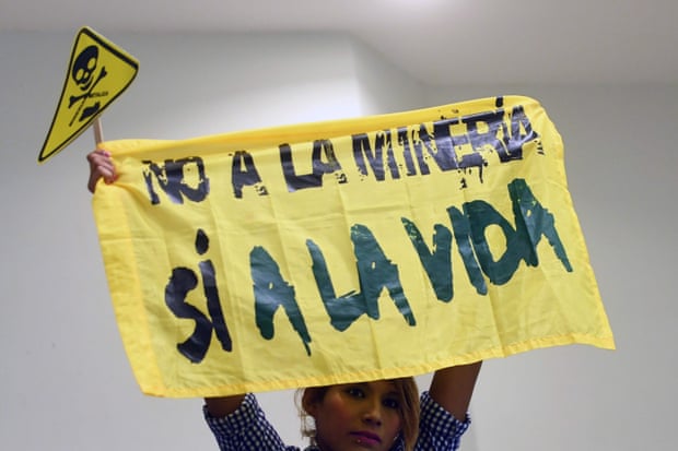 A protester at the legislative assembly in San Salvador holds a banner reading ‘No to mining, yes to life’
