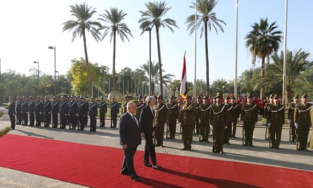 Abadi and May review the honour guard in Baghdad.