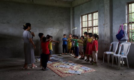 Kuki-Zo children, displaced by the ethnic violence of Manipur, attend a makeshift school in a relief camp.