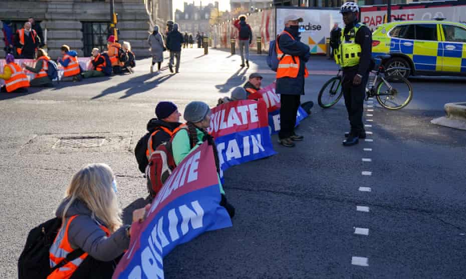 Protesters from Insulate Britain blocking Great Charles Street Queensway in Birmingham.