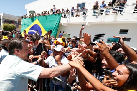 Jair Bolsonaro is greeted by supporters in Coremas, Paraiba state, Brazil, last month.