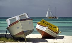 Aruba colourful boats on white sand beach
