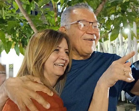 Enrique Márquez has his arm around his wife