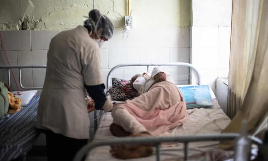 A nurse treats a patient suffering from mucormycosis in Jaipur, India