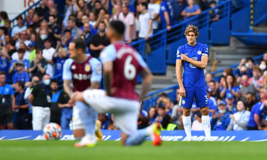 Chelsea's Marcos Alonso points to the ‘no room for racism’ message on the sleeve of his shirt before the match against Aston Villa this month.