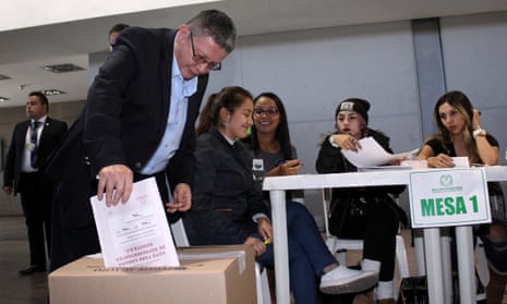Pablo Catatumbo of the political party Farc deposits his vote during the legislative elections Monday in Bogota, Colombia.