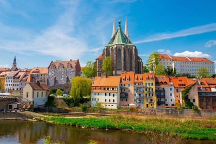 Church dominating town by river