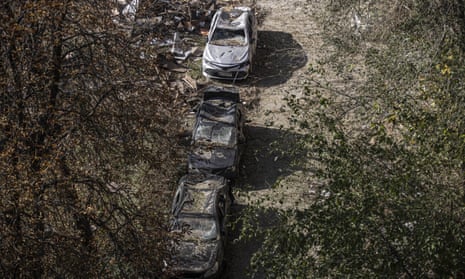 Buildings were destroyed and parts from wrecked cars were scattered around.