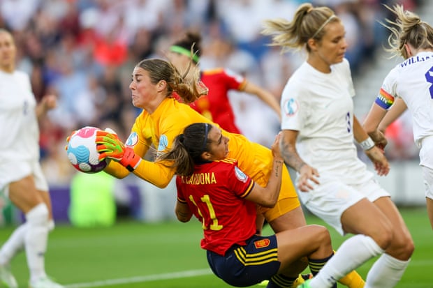 England goalkeeper Mary Earps holds onto the ball whilst under pressure from Marta Cardona of Spain.