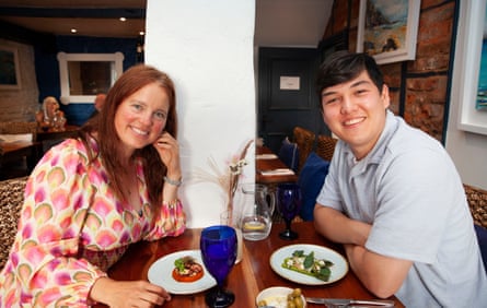 Anna and JJ chatting across a restaurant table