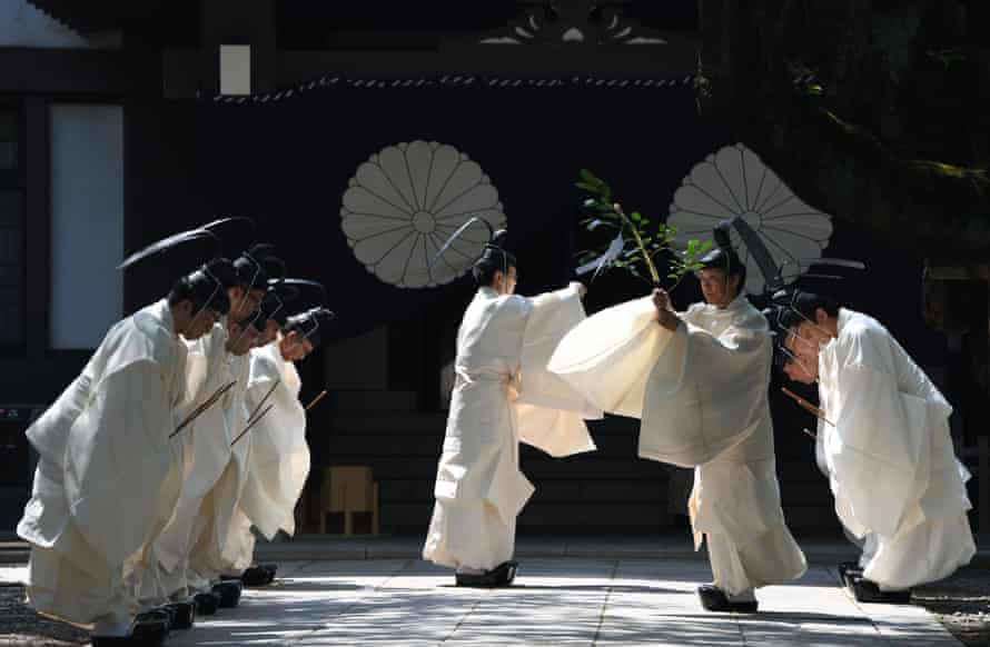 Priests prepare to perform a Shinto ritual during the three-day spring festival at the shrine in Tokyo on April 22, 2018.