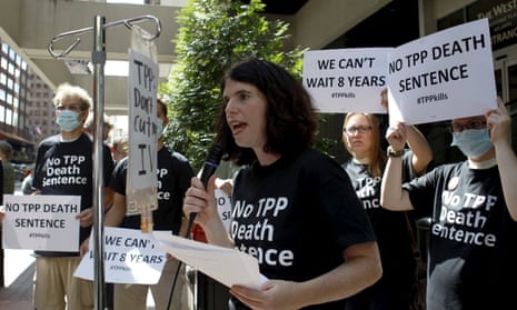 A protest takes place outside the hotel where the Trans-Pacific Partnership Ministerial Meetings are being held in Atlanta.