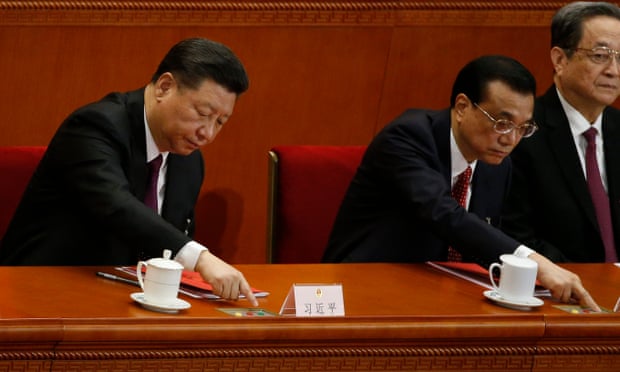 Chinese President Xi Jinping and Premier Li Keqiang press buttons to vote during the first session of the 13th National People’s Congress (NPC) at the Great Hall of the People in Beijing, China.