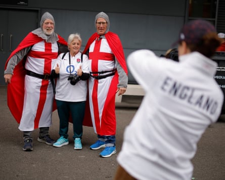 England fans have photos taken outside the stadium.