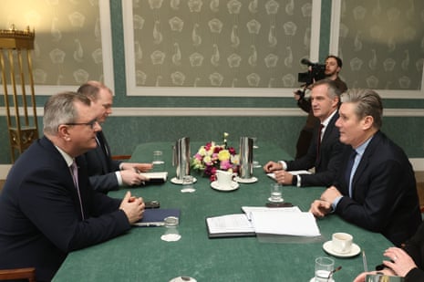 Keir Starmer (right) meeting Jeffrey Donaldson, the DUP leader (left), at Stormont in Northern Ireland today.