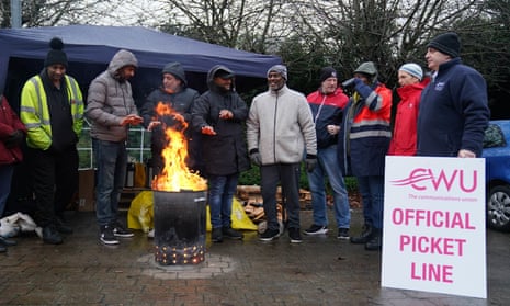 Postal workers from the CWU union on the picket line outside the central delivery office and mail centre in Birmingham today.