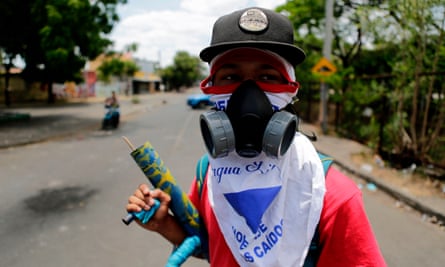 A student carrying a makeshift mortar is pictured at Nicaragua’s Polytechnic University, during protests against Daniel Ortega’s government in Managua on Wednesday.